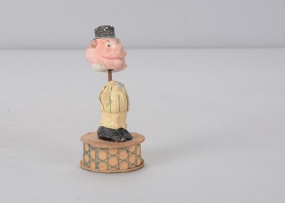 Lot 56 - A small early 20th century composition comic nodder candy or sweet box