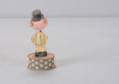 Lot 56 - A small early 20th century composition comic nodder candy or sweet box
