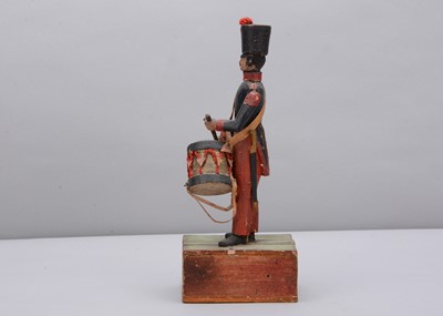 Lot 70 - A mid 19th century Thüringen composition and wood hand cranked French drummer toy