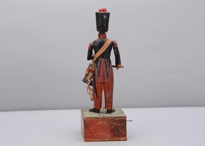 Lot 70 - A mid 19th century Thüringen composition and wood hand cranked French drummer toy