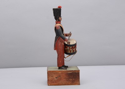 Lot 70 - A mid 19th century Thüringen composition and wood hand cranked French drummer toy