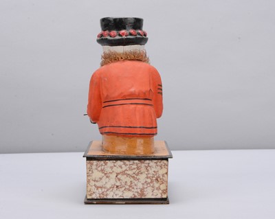 Lot 74 - A mid to late 19th century Thüringen Yeomen of the Guard (Beefeater) eating a sausage crank handled ‘eater’