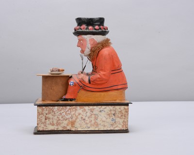 Lot 74 - A mid to late 19th century Thüringen Yeomen of the Guard (Beefeater) eating a sausage crank handled ‘eater’