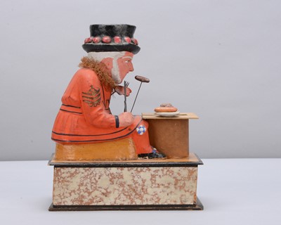 Lot 74 - A mid to late 19th century Thüringen Yeomen of the Guard (Beefeater) eating a sausage crank handled ‘eater’