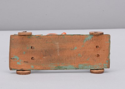 Lot 76 - A mid 19th century Thüringen composition and wood British mounted soldier pull along toy