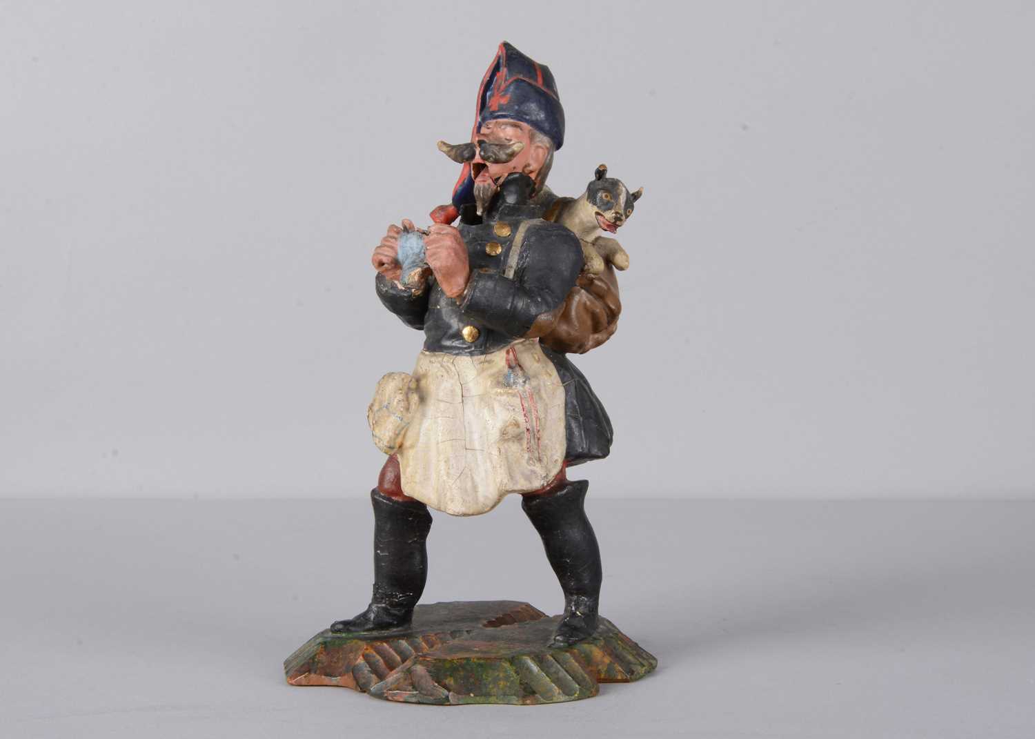 Lot 87 - A mid 19th century German knitting veteran nodder