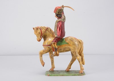 Lot 93 - A mid 19th century Germany carved wooden mounted red Hussar, possibly Oberammergau