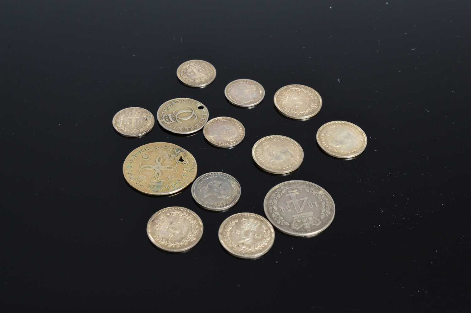 Lot 96 - Thirteen small collectable coins