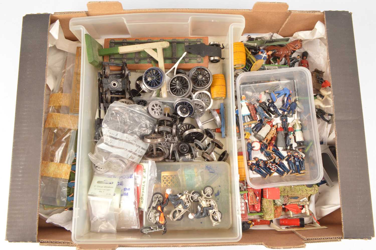 Lot 704 - Large quantity of 0 Gauge course scale wheels bogies and Accessories and various metal and plastic Figures Military and Lineside Accessories and street furniture  (qty)