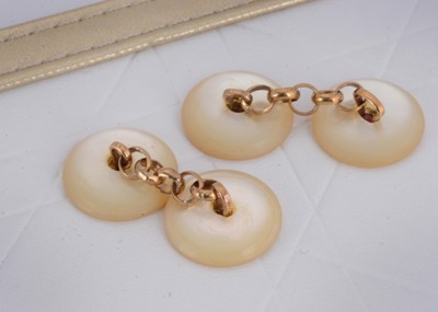 Lot 6 - A pair of mother of pearl and synthetic ruby button cufflinks