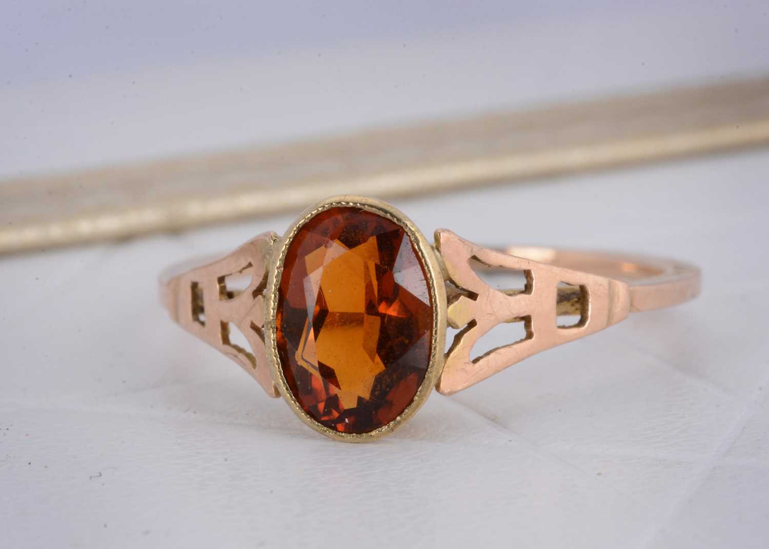 Lot 9 - A 9ct gold garnet dress ring