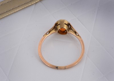 Lot 9 - A 9ct gold garnet dress ring