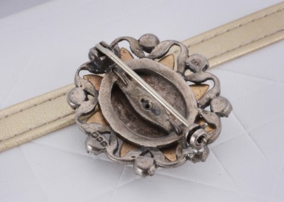 Lot 18 - A George VI silver, enamel and paste set oval brooch