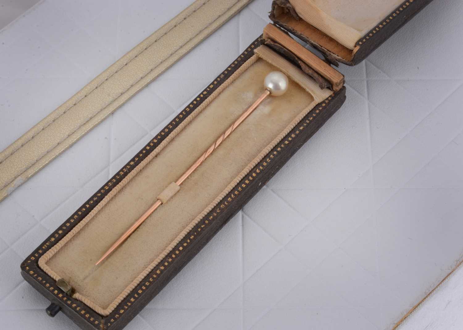 Lot 22 - An Edwardian natural pearl stick pin