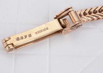 Lot 34 - A 9ct gold and platinum lady's circular diamond set Vertex cocktail watch