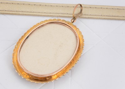 Lot 43 - An Edwardian gold and seed pearl framed ivory miniature