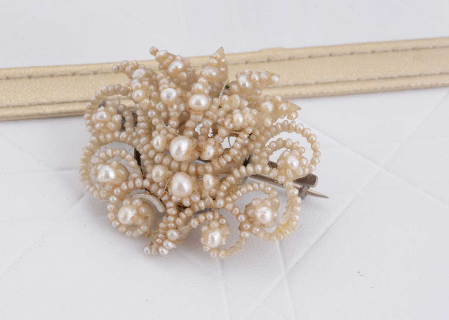 Lot 51 - A 19th Century seed pearl and mother of pearl brooch
