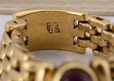 Lot 63 - An 18ct gold ruby chain ring
