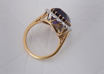 Lot 65 - An 18ct gold amethyst and diamond cluster ring