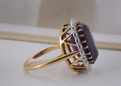 Lot 65 - An 18ct gold amethyst and diamond cluster ring