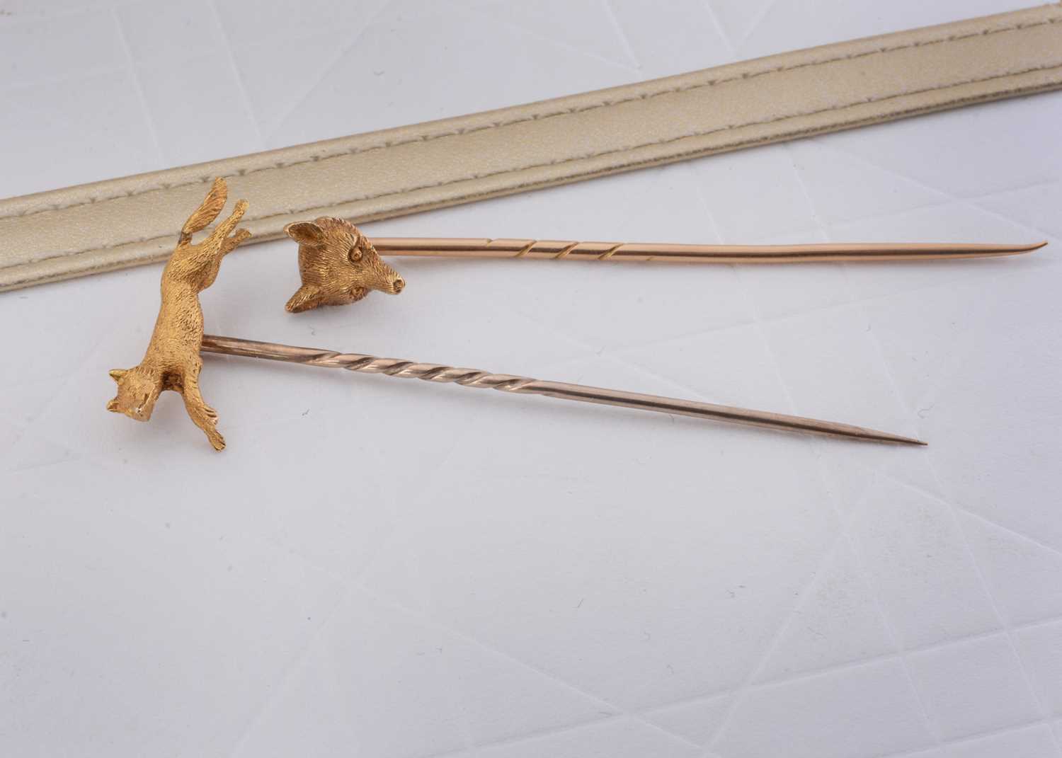 Lot 73 - Two hunting yellow metal stick or stock pins