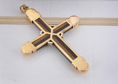 Lot 77 - A tiger's eye and 14ct gold diamond set cross pendant