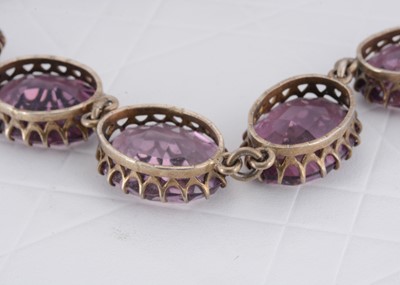 Lot 79 - A white metal and mauve paste necklace and bracelet set