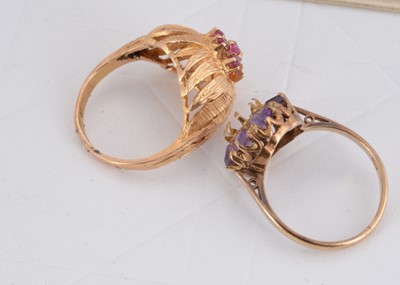Lot 86 - A continental yellow metal and ruby set cluster ring