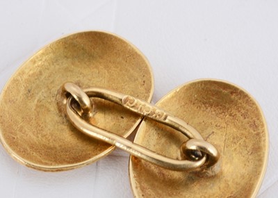 Lot 87 - A pair of 18ct gold oval cufflinks united by a large oval link