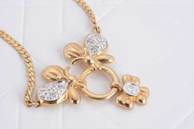 Lot 123 - A contemporary 9ct gold and diamond pendant necklace