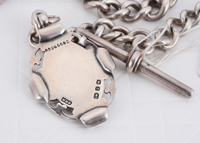 Lot 131 - A Victorian silver curb link graduated watch chain and fob medallion