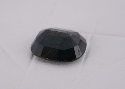 Lot 139 - A mixed cushion cut loose sapphire