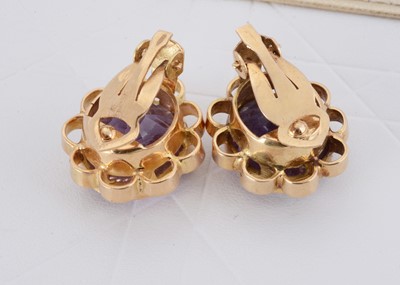 Lot 148 - A pair of yellow metal 750 marked amethyst clip earrings