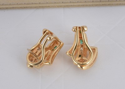 Lot 158 - A pair of continental 18k marked yellow metal emerald and diamond clips