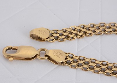 Lot 165 - An Italian 750 marked yellow metal textured mesh bracelet