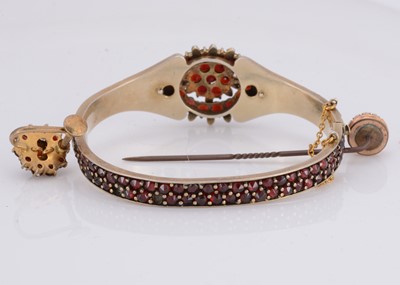Lot 33 - A Bohemian garnet silver gilt hinged bangle