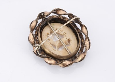 Lot 80 - A 19th Century gilt metal antler carved brooch