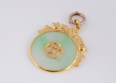Lot 96 - A Chinese high carat jadeite jade disc pendant