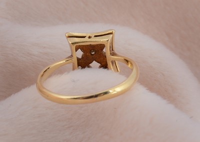 Lot 26 - An art deco platinum and 18ct gold square shaped tablet ring
