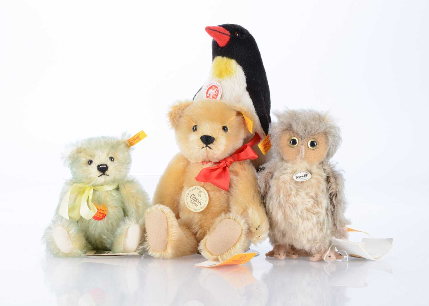Lot 50 - Four Steiff yellow tag teddy bears and soft toy animals