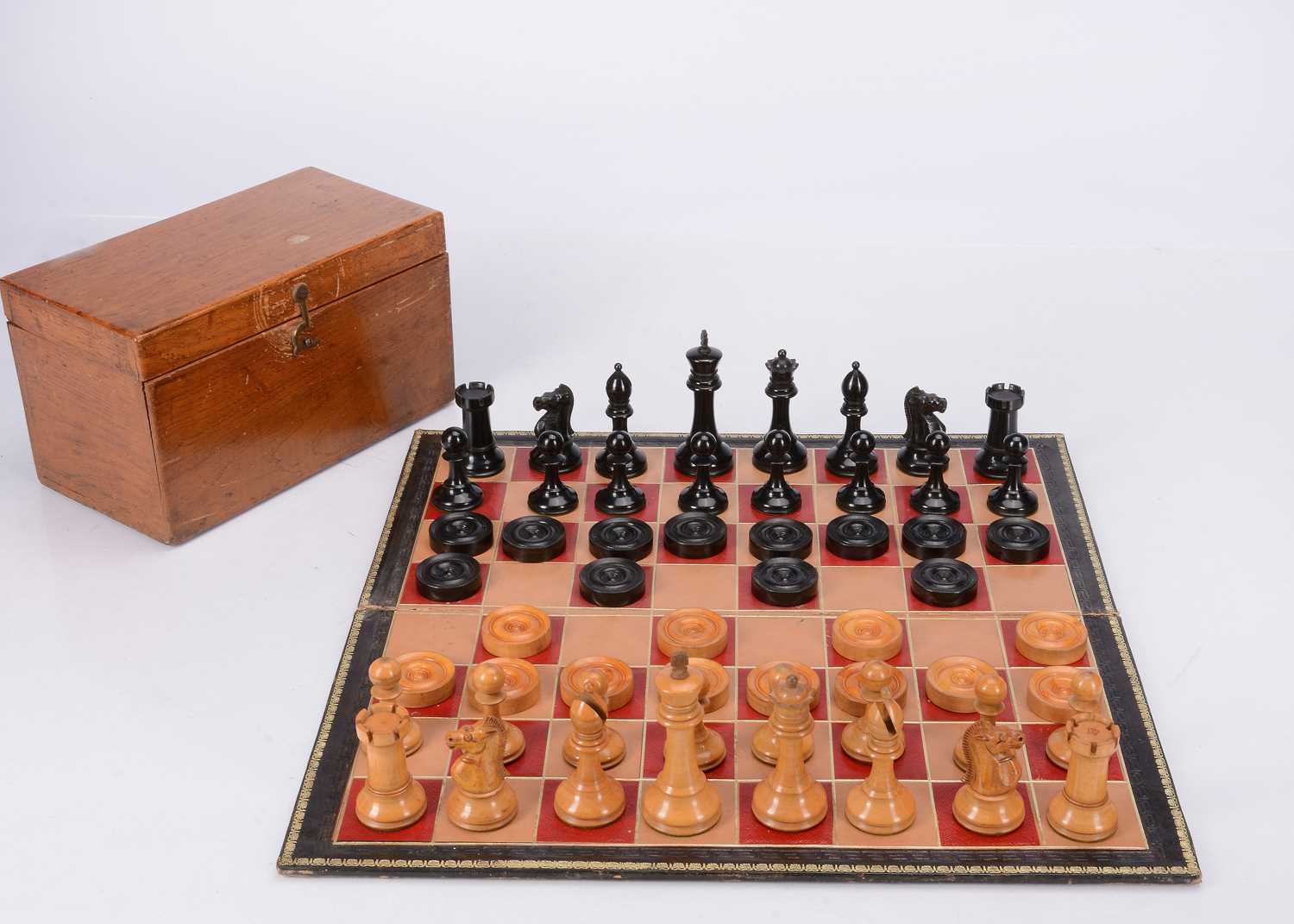 Lot 136 - An early 20th century Staunton chess and draught set