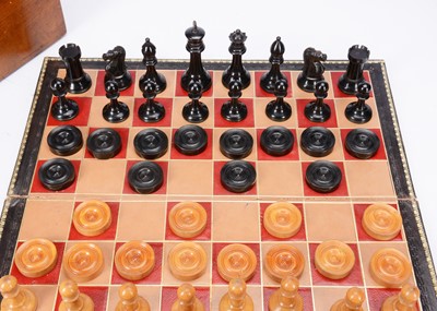 Lot 136 - An early 20th century Staunton chess and draught set