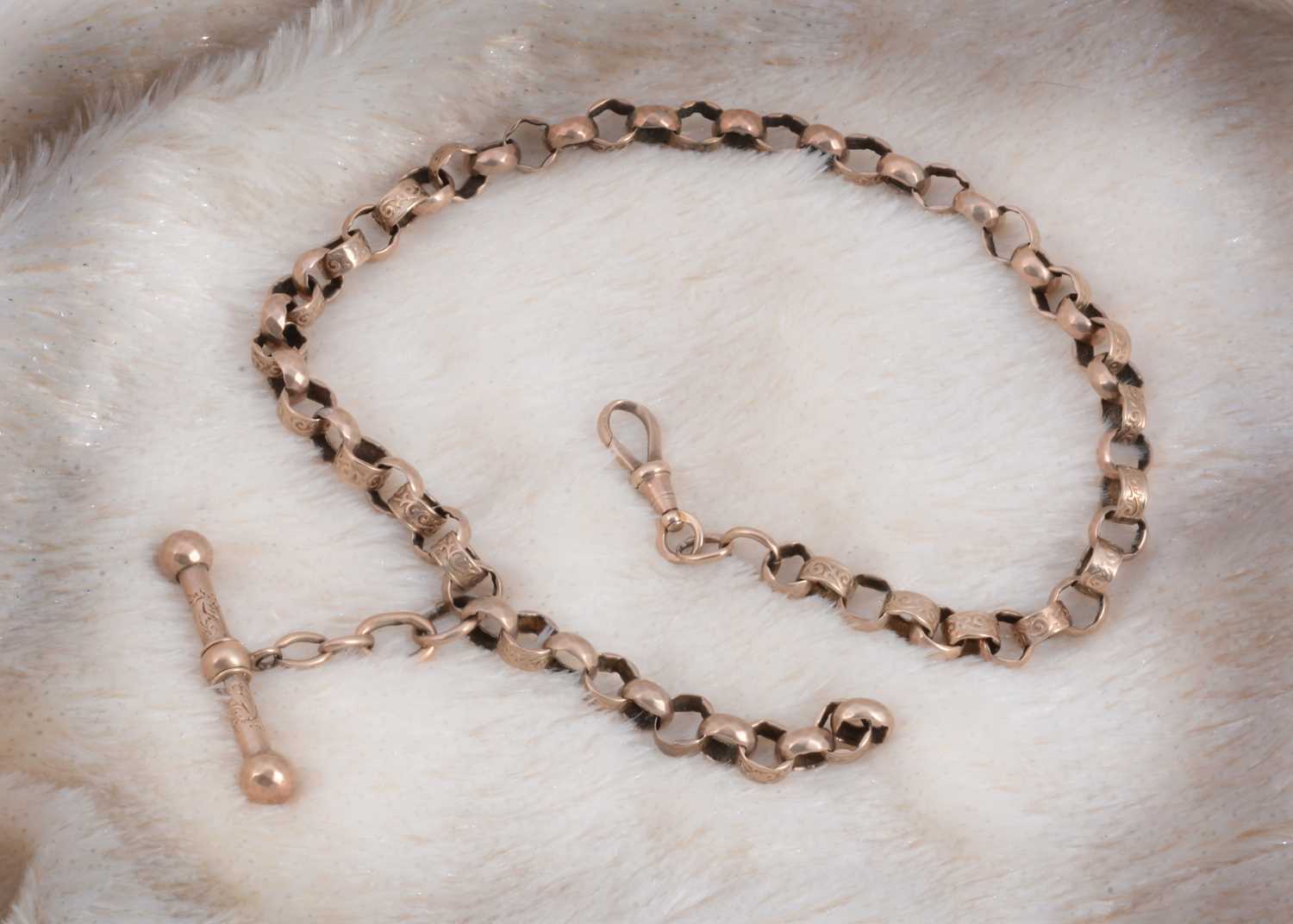 Lot 12 - A Victorian circular engraved link watch chain