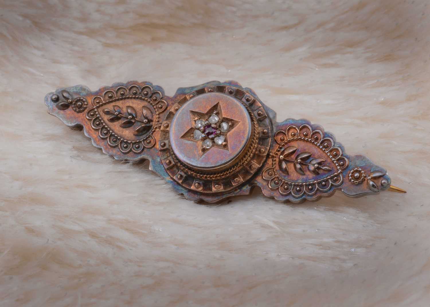 Lot 73 - A 15ct gold Victorian diamond and ruby bar brooch