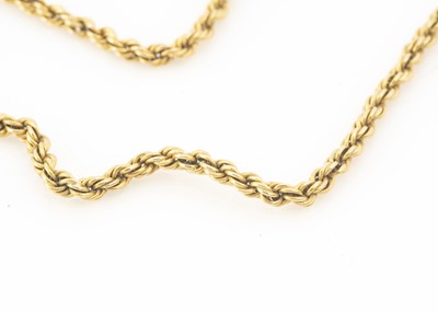 Lot 23 - An early 20th century yellow metal muff chain