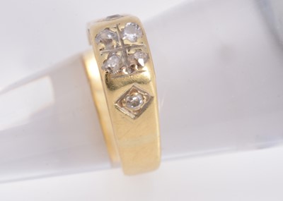 Lot 12 - An 18ct yellow gold diamond set dress ring