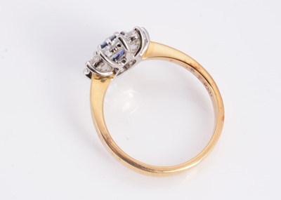 Lot 17 - A 18ct gold sapphire & diamond cluster ring