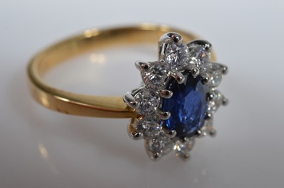 Lot 17 - A 18ct gold sapphire & diamond cluster ring