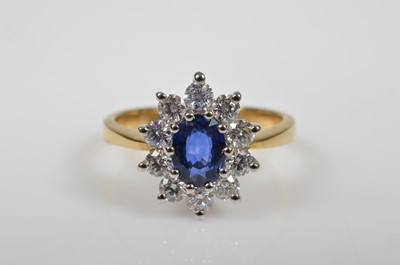 Lot 17 - A 18ct gold sapphire & diamond cluster ring