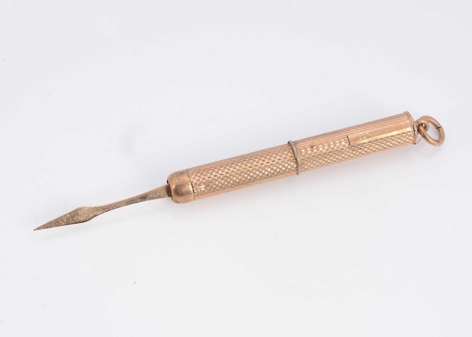 Lot 21 - A 9ct gold tooth pick